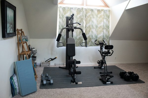 How to ensure compliance with local building codes when installing a home gym in a basement in York?